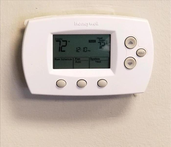 Thermostat showing inside temp